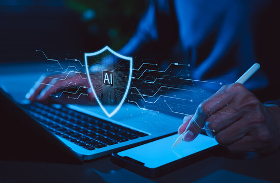 AI cybersecurity protection and digital data privacy concept. Professional using laptop with AI shield interface representing cyber defense, secure access, data protection, intelligent privacy control