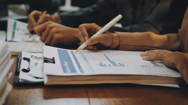 Anonymous hands of an accountant working with documents
