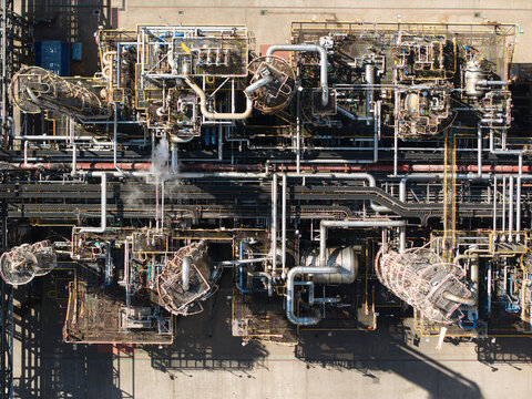 Aerial view of the Salt End industrial complex featuring intricate piping networks, storage tanks, and metal structures in Salt End, England, United Kingdom.