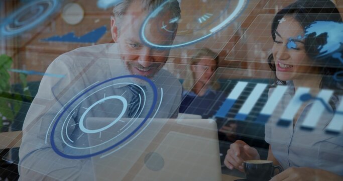 Working bearded senior, team in biz-casual around laptop in cafe, with ceramic cup, viewing AR UI