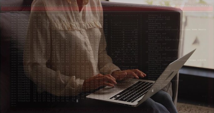 Typing woman wearing blouse and jeans sitting on couch by window at home, laptop overlaying hex