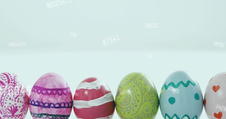 Displaying row of painted glossy eggs on white table with pale blue gradient and faint numbers © vectorfusionart