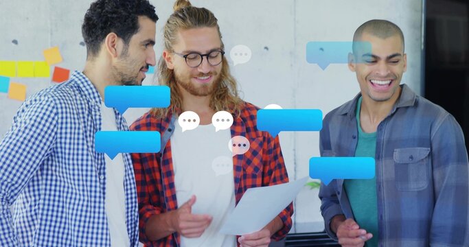 Reviewing three men pointing at document in office, center wearing plaid shirt, speech bubbles