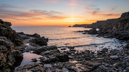 Obraz premium Calm rocky coastline at sunset with gentle waves, peaceful seascape for travel, reflection and nature concepts, warm horizon glow, balanced composition, soft light, crisp focus, premium scenic detail,