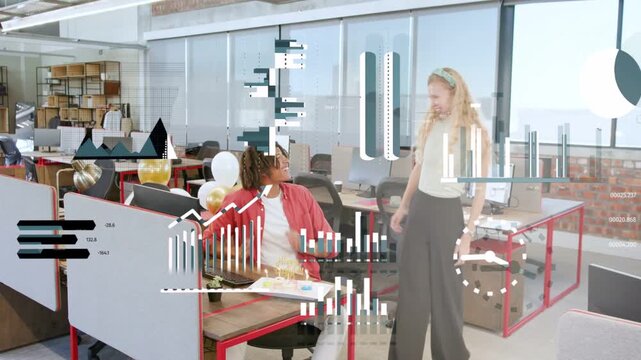 Woman bringing cake to man at office desk, data overlays cycling, coworkers hugging celebrating
