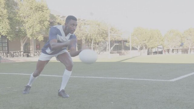 Male soccer player placing hands on corner ball, launching and chasing to retrieve, then returning