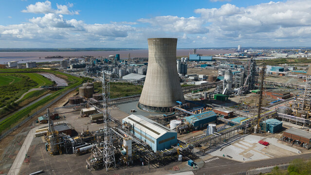 Aerial view of the Salt End chemical park and power station featuring a large cooling tower and industrial infrastructure under a cloudy sky Salt End, England, United Kingdom.