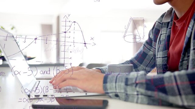 Student placing hands on keyboard, typing at laptop and revealing graphs and formulas for education