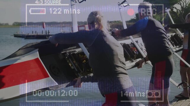 4-person rowing crew coordinating launch from dock, lowering red bow while camera overlay recording