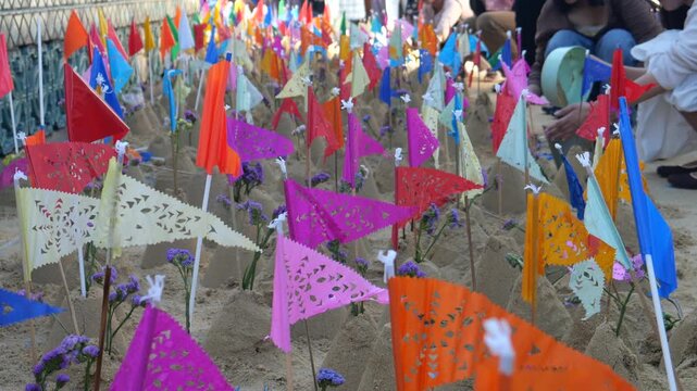 People make small sand pagodas in temples during the Songkran Festival (Thai New Year). This is a traditional activity in the old days to bring sand to the temple, for example, to build pagodas. 
