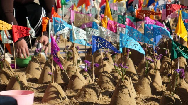 People make small sand pagodas in temples during the Songkran Festival (Thai New Year). This is a traditional activity in the old days to bring sand to the temple, for example, to build pagodas. 