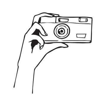 Female hand holding film camera. Hand drawn doodle outline vector illustration. Retro photography, analog camera, vintage lifestyle concept isolated on white background.
