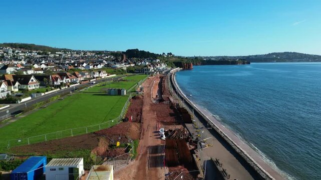 Paignton, Devon, England: DRONE VIEWS: A sea defence wall under construction on Preston Sands Green. The project will be completed in 2027 to protect seafront properties from global rising sea levels.