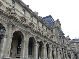 Obraz premium Paris, April 2026 : Visit of the magnificent city of Paris, Capital of France - View on different facades of buildings built by Baron Haussmann