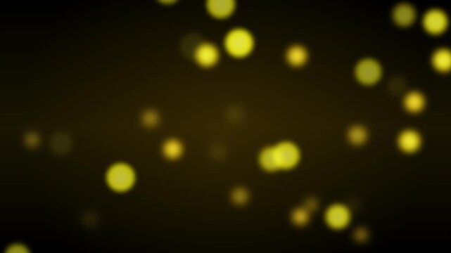 A vibrant array of glowing yellow bubbles against a dark background, creating a dynamic visual effect