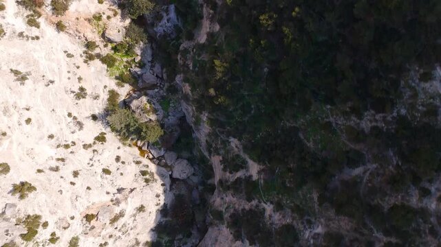 Top-Down Drone View of Eroded Limestone Floor and Footpath Inside Avakas Gorge Cyprus