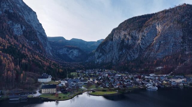 Moody Aerial View of AlpineValley Village Surrounded y Massive Limestone Cliffs