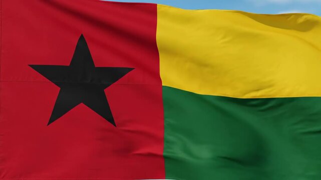 Guinea Bissau Flag Waving Gently Against a Bright Blue Sky Background