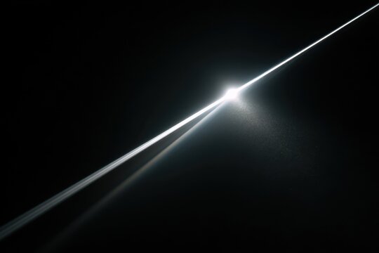Isolated beam of light cutting through darkness with subtle hazy glow