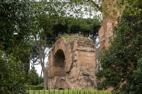 Architectural history in details of ruins, old buildings, walls, amfitheatres, arches in old part of Rome, dated from 300 BC, guided tours in Rome, Italy