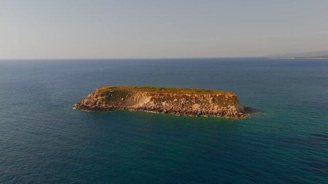 Cinematic Drone Boomerang Shot Over Geronisos Island and Turquoise Mediterranean Sea
