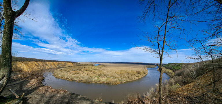 Wide angle view of Don River bend at Krivoborye natural landmark in Voronezh region under bright blue sky
