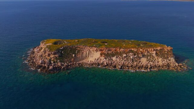 Aerial Bird's Eye Drone Pan Over Geronisos Island and Azure Mediterranean Sea Paphos Cyprus