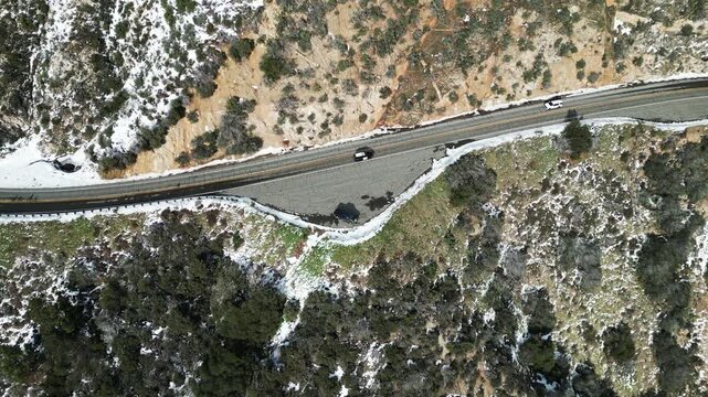 The California San Gorgonio San Bernardino Mountain Range near Mill Creek and Forest Fall in the Valley of the Falls looking at the Mountains and trees covered in Snow after a Winter Storm from a UAV 