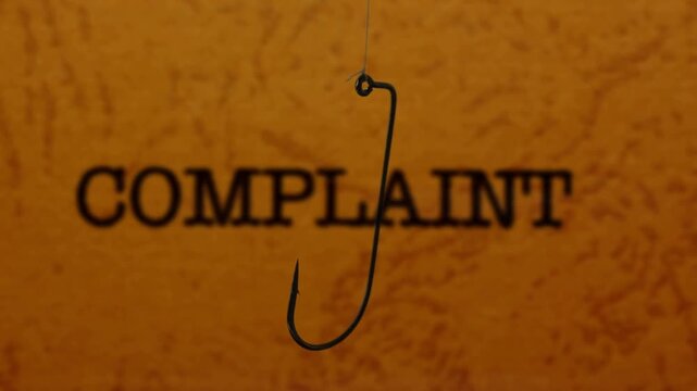 Phishing Concept with Complaint Text and Fishing Hook Symbol