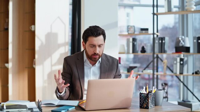 Worried boss virtual conference in office closeup. Nervous man ceo complaining