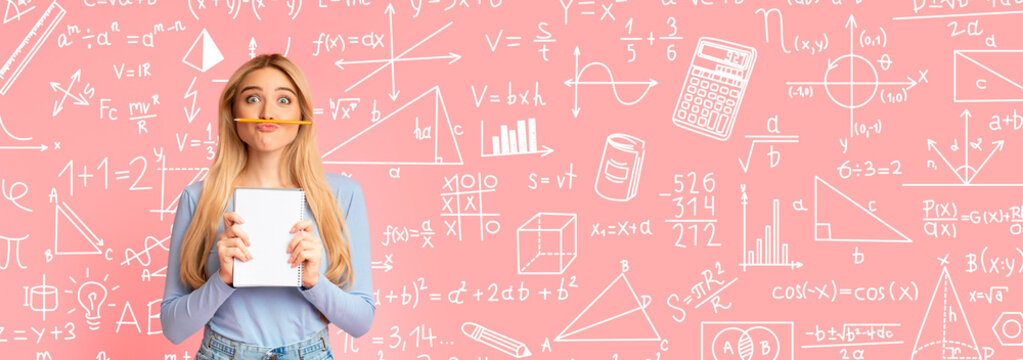 A young person stands with a notebook in hand, making a playful pose. They have a pencil placed between their lips.