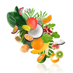 Naklejka premium Tropical fruits and green leaves in air on white background