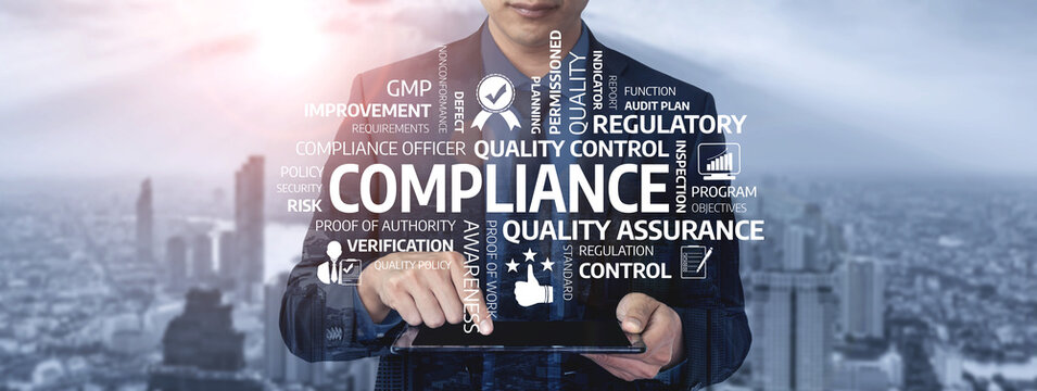 A businessman interacts with a tablet displaying compliance concepts related to quality control and regulatory standards against an urban backdrop, showcasing modern business challenges. Tessel