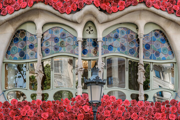 Naklejka premium Modernist Windows of Casa Batllo Decorated with Floral Garlands, Sant Jordi, Spain
