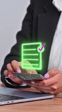 Concept of task management and business productivity using modern mobile applications. Hand scrolling on a smartphone under a bright holographic icon