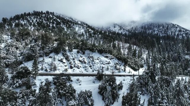 The California San Gorgonio San Bernardino Mountain Range near the Santa  Ana Watershed covered in snow along SR 38 through the Mountain Pass