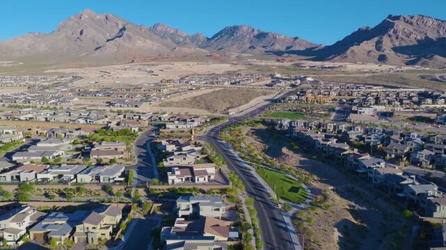 Sprawling Las Vegas Desert Suburb Below Rugged Mountain Peaks