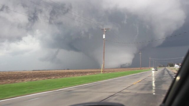 A large EF4 tornado spins violently through farmland after doing damage near Rochelle, Illinois in April of 2015.  