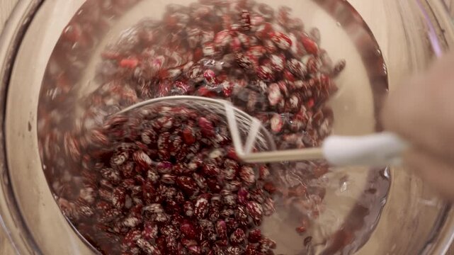 Stirring_pinto_beans_in_glass_bowl_4k_10bit