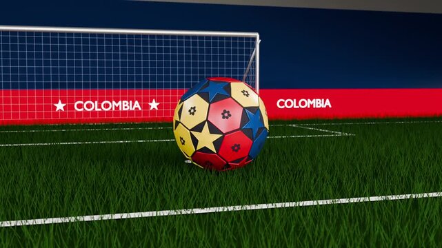 Releasing post sending colorful soccer ball rolling onto turf toward goal for camera, COLOMBIA band