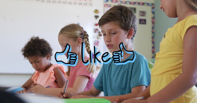 Writing kids sitting at table in class wearing bright shirts using pencils papers blue-like overlay