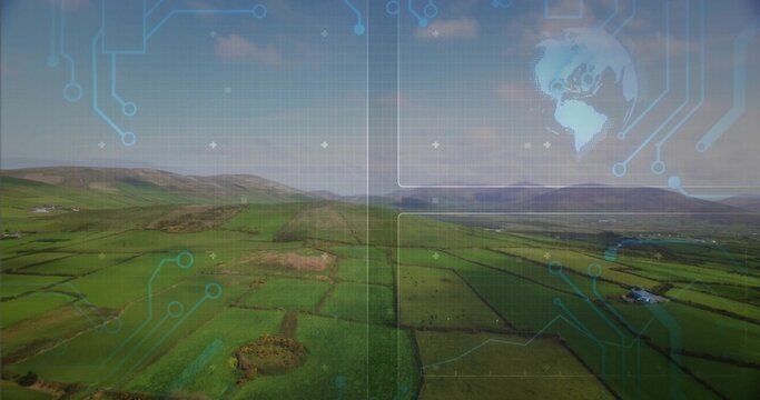 Showing aerial farmland stretching toward coastline, with hedgerows, sheds and blue circuit overlay