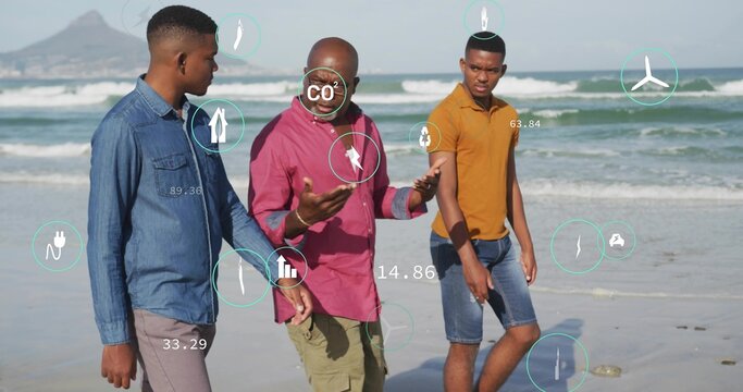 Walking trio wearing denim jacket, magenta shirt, mustard polo on sandy shoreline, showing CO2 HUD