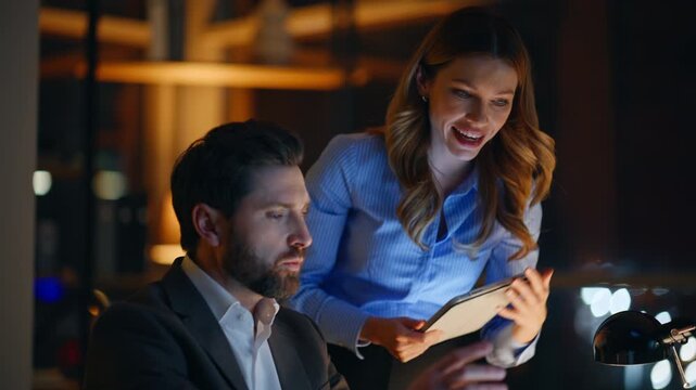 Business trainer mentoring trainee in night office closeup. Manager discussing 