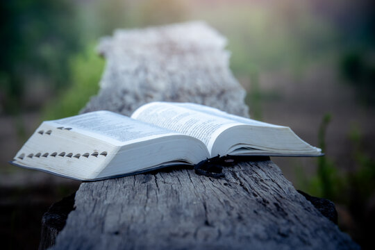 Open Bible on wooden plate, Christian Christianity background The struggle and victory for God