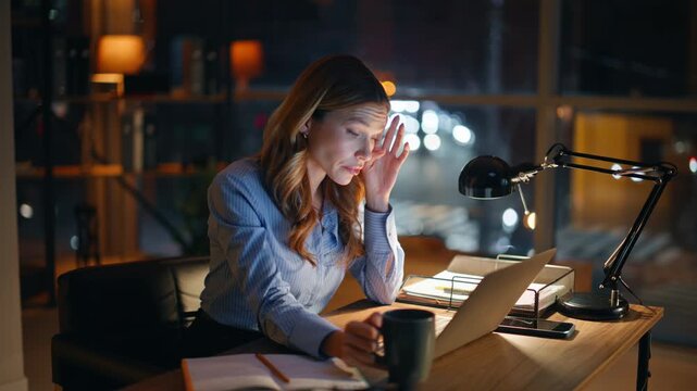 Deadline worker closing laptop feeling overwhelmed overtime job pressure closeup