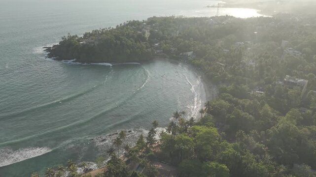 4k Beautiful evening drone shot over Hiriketiya beach - Sri Lanka