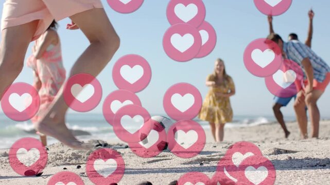 Front kicker placing and kicking ball in beach sports sparking rising pink hearts friends cheering