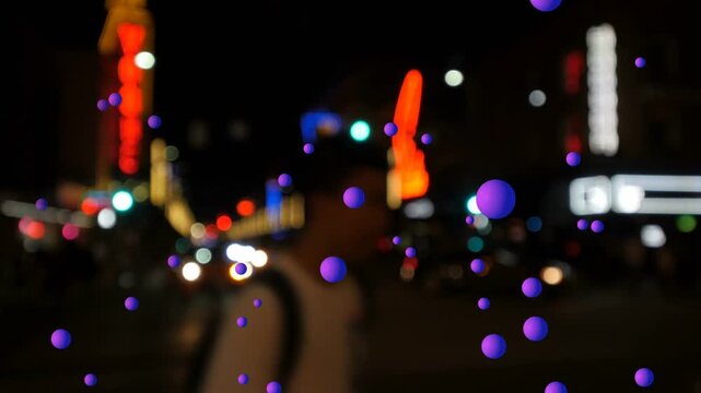 Purple spheres being animated in neon, large sphere popping, causing drift, parallax to show depth