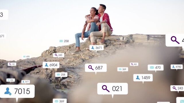 Two men sitting on ledge watching view camera pulling back as floating tech badges growing receding